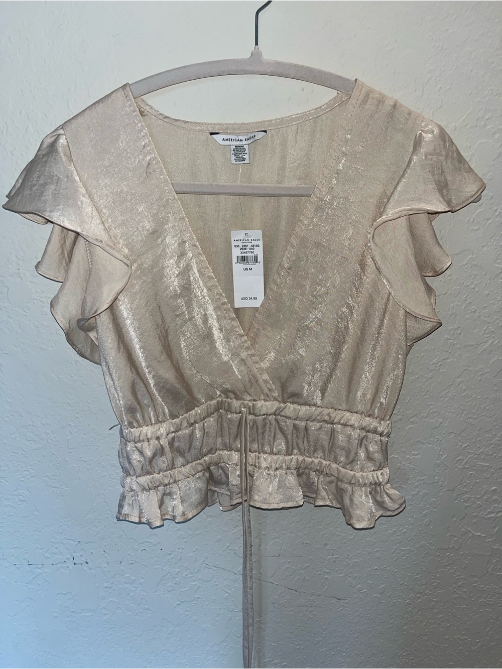 American Eagle Outfitters Shimmery Cream Ruffle-Waist Wrap Crop Top